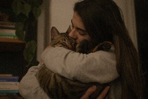 Happy pet owner with their cat